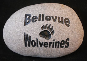 sports team rock with Bellevue Wolverines engraved on it