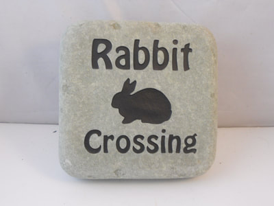 engraved rock and slate rabbit crossing sign