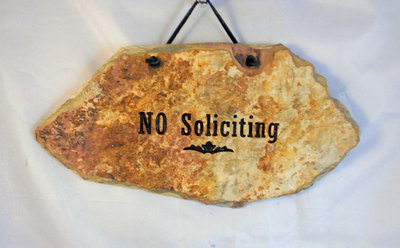 No Soliciting engraved stone sign