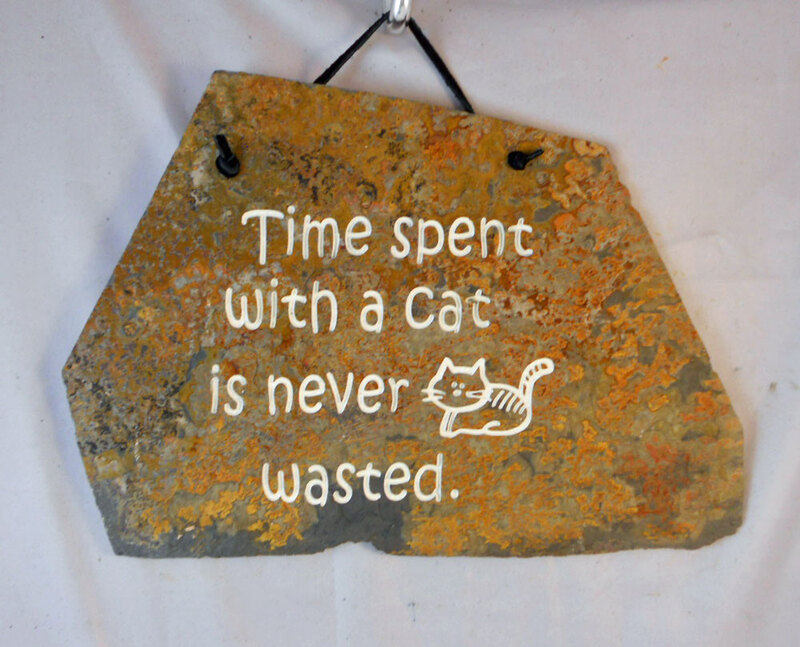 Time spent with a cat is never wasted
engraved stone sign