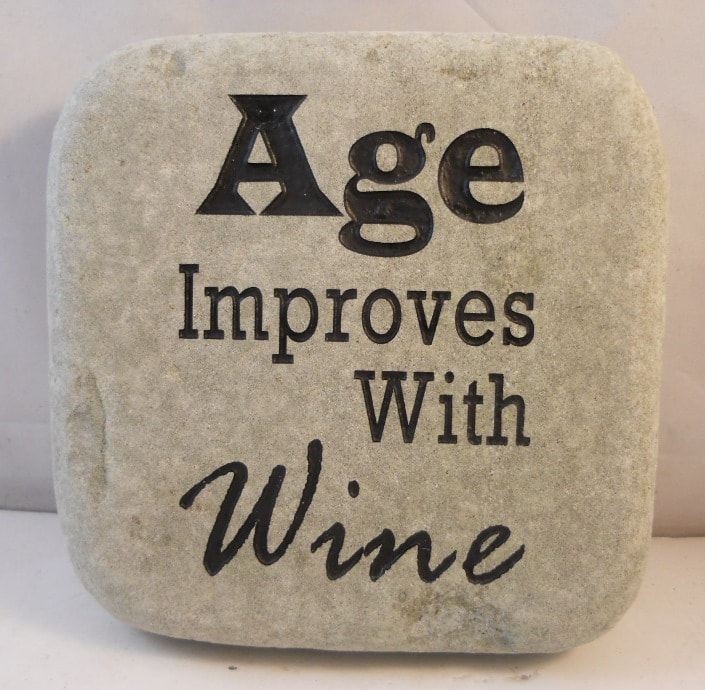 funny rock signs that say, age improves with wine