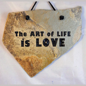 Engraved rock gifts for faith and love with "Art of Life is Love"