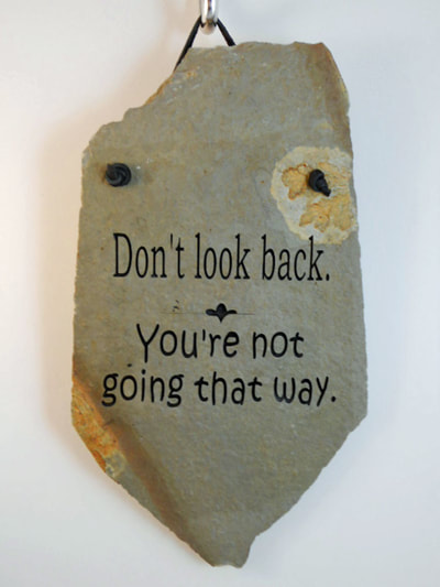 Engrave rock plaque funny signs with "Don't look back your going the wrong way"