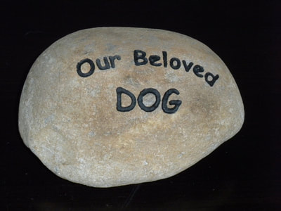 engraved dog headstone "Our beloved dog" rock dog memorial sign