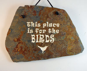 Engraved rock plaque sign with  - this place is for the birds