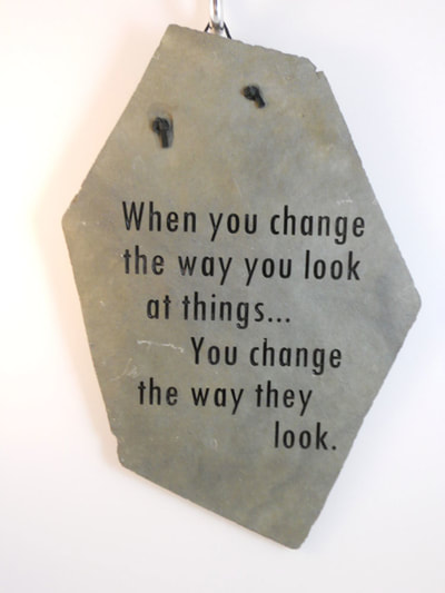 engraved rock sign with changing the way you look at things