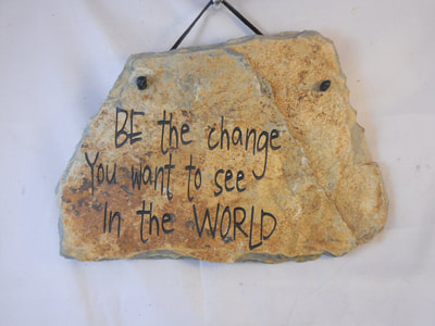 Be the change you want to see in the world.
engraved stone sign