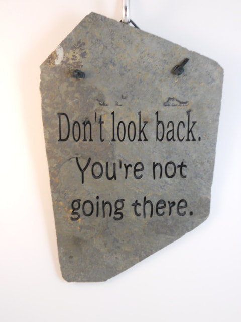 Don't look back. You're not going there.
funny engraved stone sign