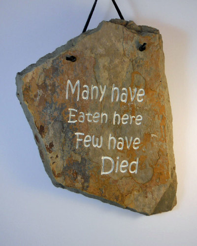 Many have Eaten here Few have Died
funny engraved stone sign