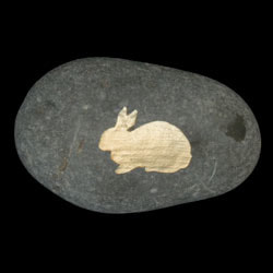 engraved rock rabbit photo on grave marker