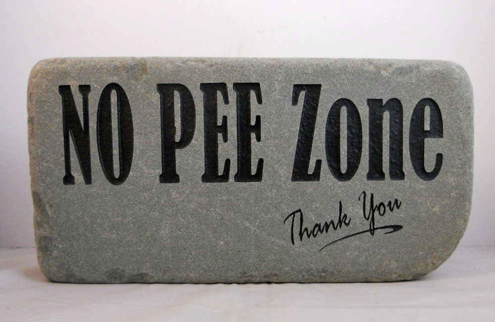 Engraved  Rock no pee zone signs and plaques