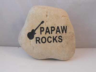 engraved custom birthday rock that says Papaw Rocks with guitar photo