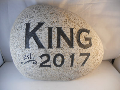 customized rock entrance sign with family name and est. date