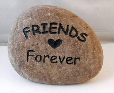 engraved rock sign with friends for ever and heart photo