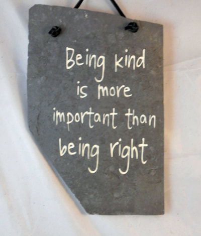 engraved rock sign plaque about being kind is more important than being right
