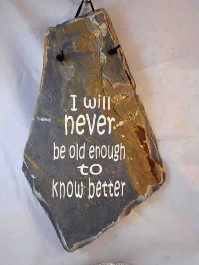 Engraved rock plaques with "I will never be old enough to know better" birthday gift ideas