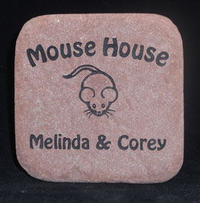 engraved stone door stop that says Mouse House