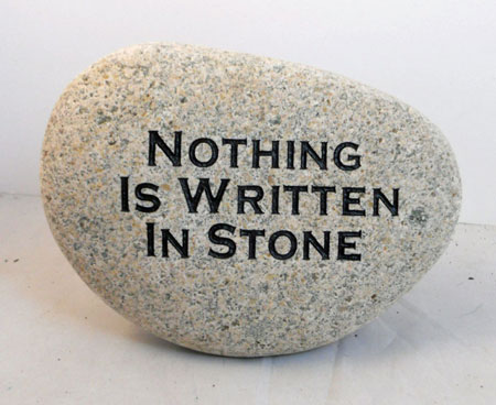 stone and plaque signs for Nothing is written in stone