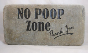Engraved Rock sign with No Poop Zone 