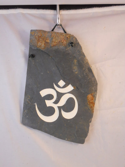 Om Silhouette engraved stone sign