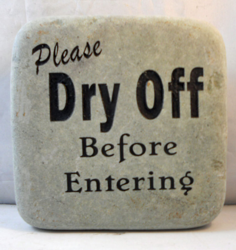 Engraved Rock with please dry off before entering