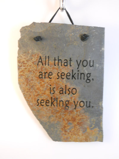 engraved rock sign and plaque that says all you are seeking are also seeking you