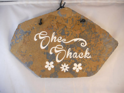She Shack engraved stone sign