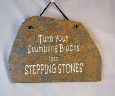 Turn your stumbling blocks into stepping stones
engraved stone sign