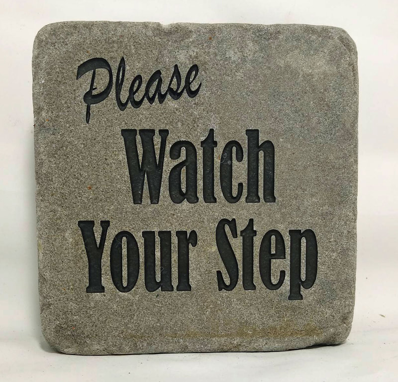 Please Watch Your Step
engraved stone sign